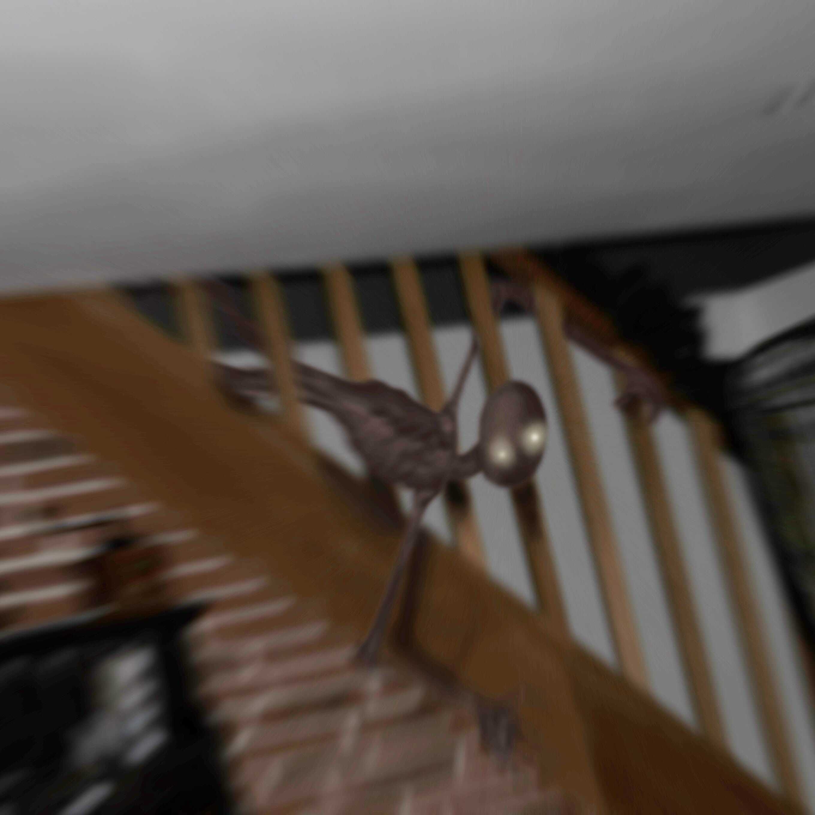 Dessin d'une créature entre les barres d'un escalier